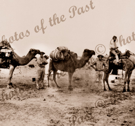 Three camels and their riders at Lake Callabonna SA South Australia