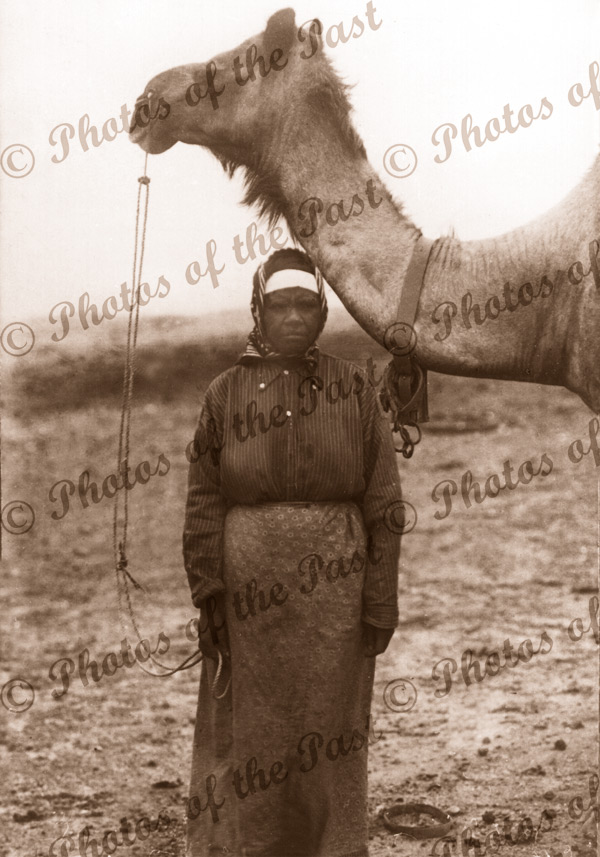 Aborigine lady with camel.