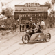 Old Oldsmobile motor car with 2 men.1902. Grand Prix. car racing.