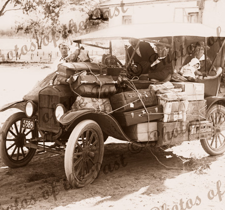 Pendle's Transport Service, Renmark, SA (bags all over old car). South Australia. c1920s. Car