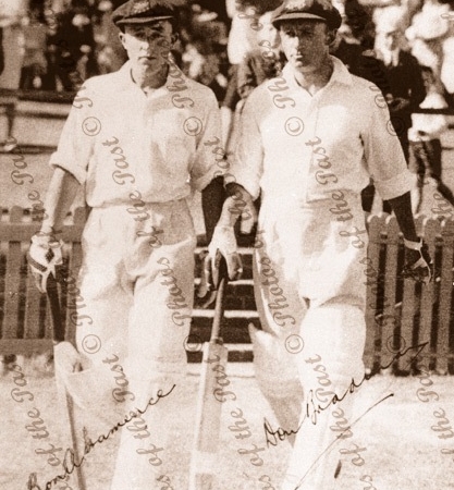 Ron Hamence and Don Bradman, walking to bat. (with signatures) c1940s