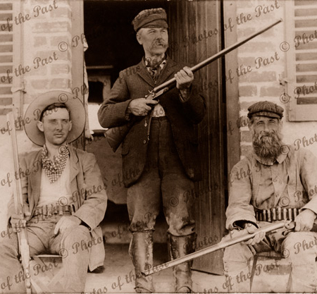 Two shooters & their shot guns & shell belts c1910, hunting