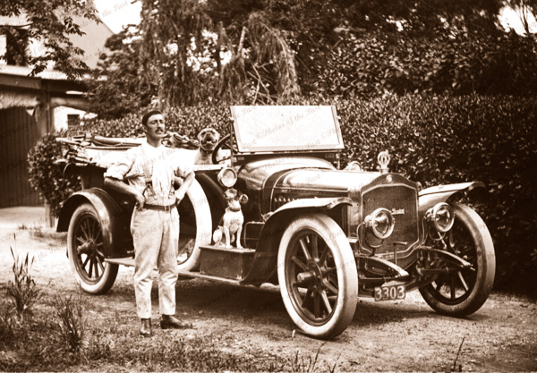 G. Legoe of Hyde Park with his De Dion Bouton motor car. 1912. South Australia. Dog