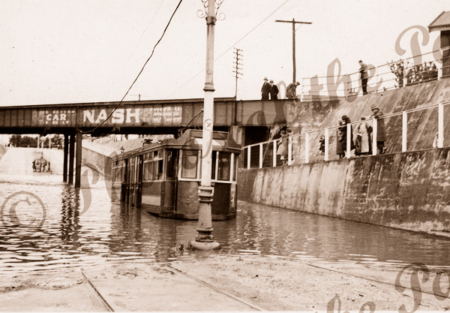 Tram in flooded subway at goodwood, SA. South Australia. c1920s