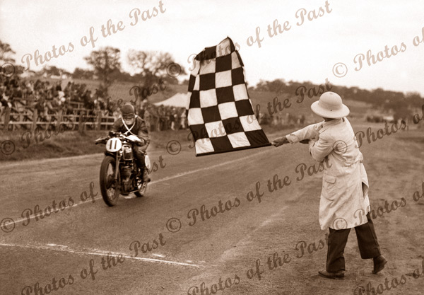 Stanley Woods (England) crossing line. Junior Tourist Trophy, Victor. Harbor, SA. 29 December 1936. South Australia. motor bike racing
