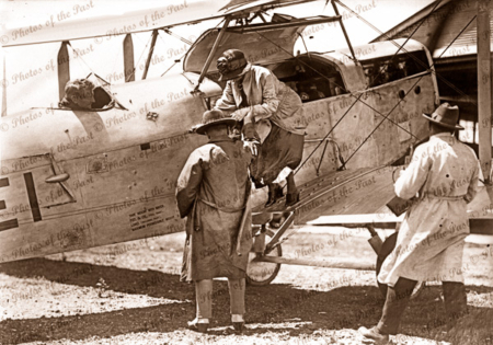 Lady passenger being assisted from bi-plane at Albert Aerodrome SA.c 1920. South Australia. aviation