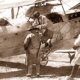 Lady passenger being assisted from bi-plane at Albert Aerodrome SA.c 1920. South Australia. aviation