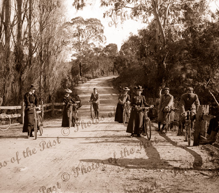 Ladies & Gents with bicycles on country road, c1890s
