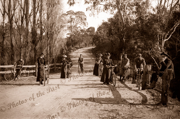 Ladies & Gents with bicycles on country road, c1890s