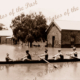Rowers in flooded street, Mannum SA. South Australia. 1917. Murray River