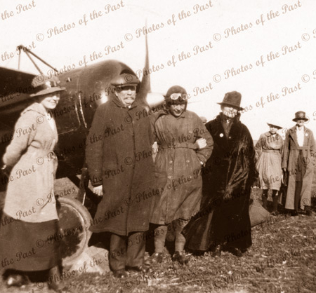 Butler (centre) at Minlaton, SA after first flight across Gulf St Vincent. Flanked by father,mother and sister Ann Maria. Taken prior to return trip to Adelaide 11 August 1919. South Australia. Aviator
