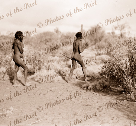 Aborigine family. Woman with boy, man with spear & boomerang. c1936