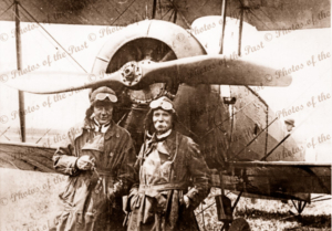 Aviator Harry Butler & TJ Richards with bi-plane. c1919