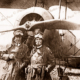 Aviator Harry Butler & TJ Richards with bi-plane. c1919
