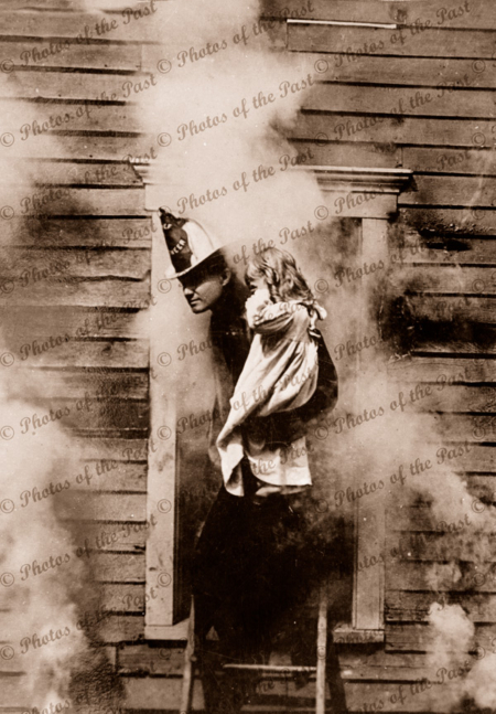 The Rescue (Fireman rescues child) from burning building. c1900. girl