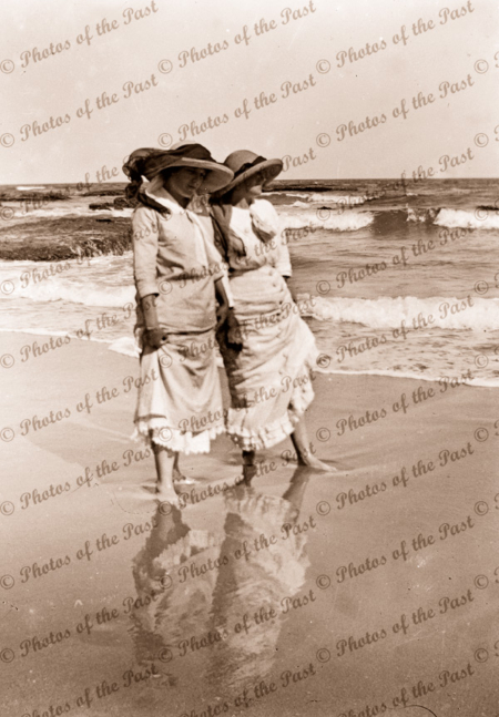 Down at the seaside. Two ladies wading in the shallows. c1920s. Beach