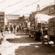 Loaded trucks of cased peaches arriving at cannery, Shepparton, Victoria c1946