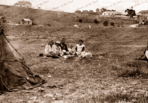 Aboriginal group sitting on grass. Victor Harbor, South Australia, c1890s