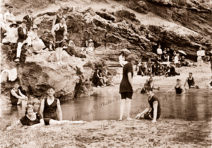 Bathers having fun in a pool. Rockpool. Swimming, beach, c1920