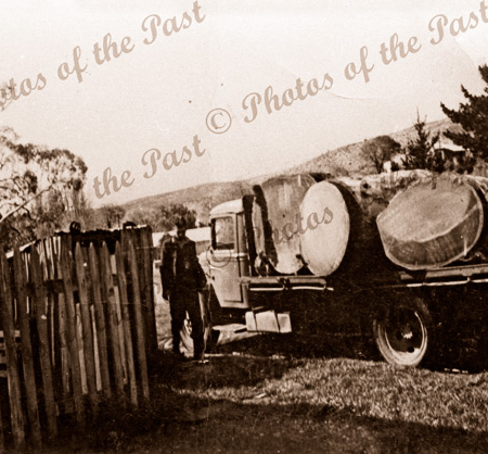 Dick Garrett's Bedford truck with logs on the weighbridge near hall, South Australia, 1930s