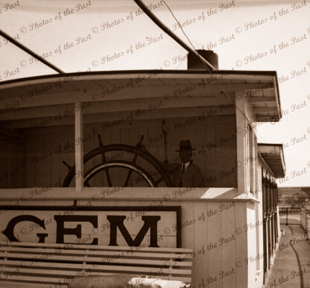 Captain Payne at wheel of PS GEM. Paddle steamers, river boats