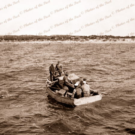 Taking cargo ashore in small boat from SS YANDRA. Flinders Island, South Australia. 1930s