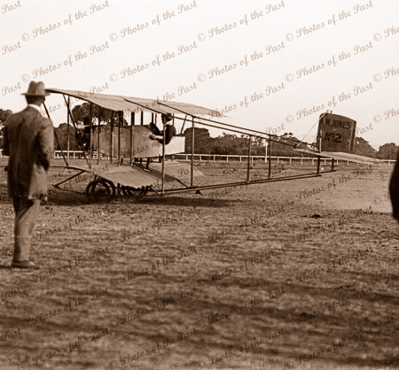 Caudron Pusher? Bi-plane about to take off. AW JONES No2 on tail. Possibly Cheltenham Racecourse, SA. C1913