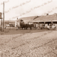Alf Richardson's Hotel on Corner main St with coach leaving. JJ Barrettt's General Store on left (near) corner. White Cliffs, NSW. New South Wales. 1908.