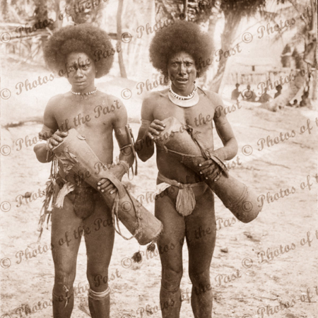 Two Papuans with kundu drums. Papua New Guinea