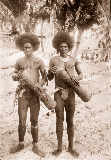 Two Papuans with kundu drums. Papua New Guinea