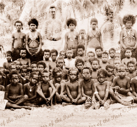 Large Papuan group with two visitors. Papua New Guinea