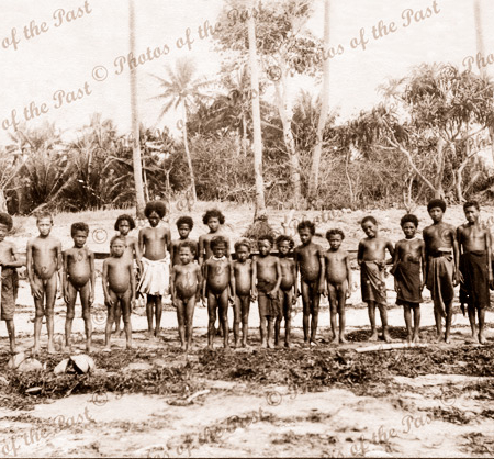Group of Papuan children on beach. Papua New Guinea.
