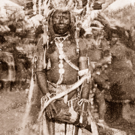 Papuan in full dress with drum. Papua New Guniea