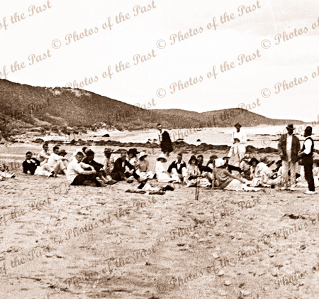 Mixed group on beach at Spout Creek, Eastern View, Vic. Aireys Inlet beyond. Great Ocean Road. c1920s