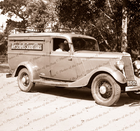 Photographer Charles Herschell's van with driver. 'Herschell's Sound Films" signage. c1930s