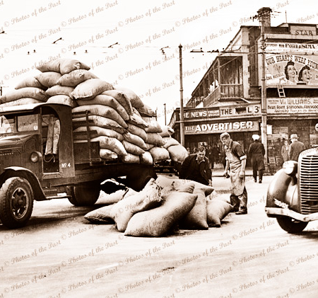 Mishap, Black Diamond Corner, Port Adelaide. South Auatralia. c1940s. Cars, traucks. Bags of produce