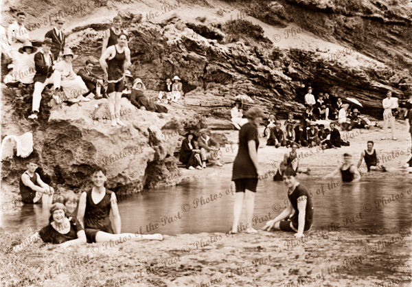 Bathers having fun in a rock pool